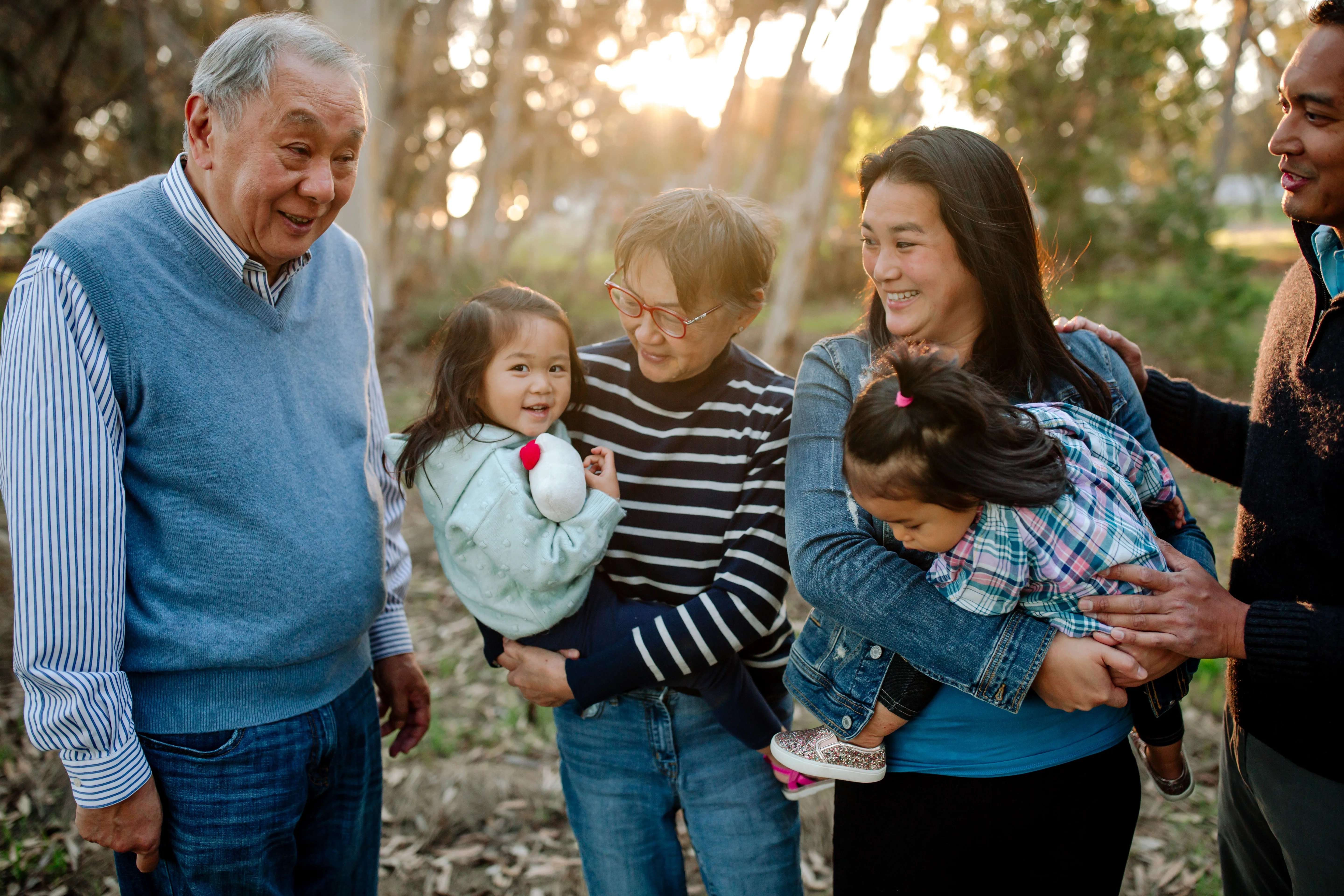 a group of people holding a child