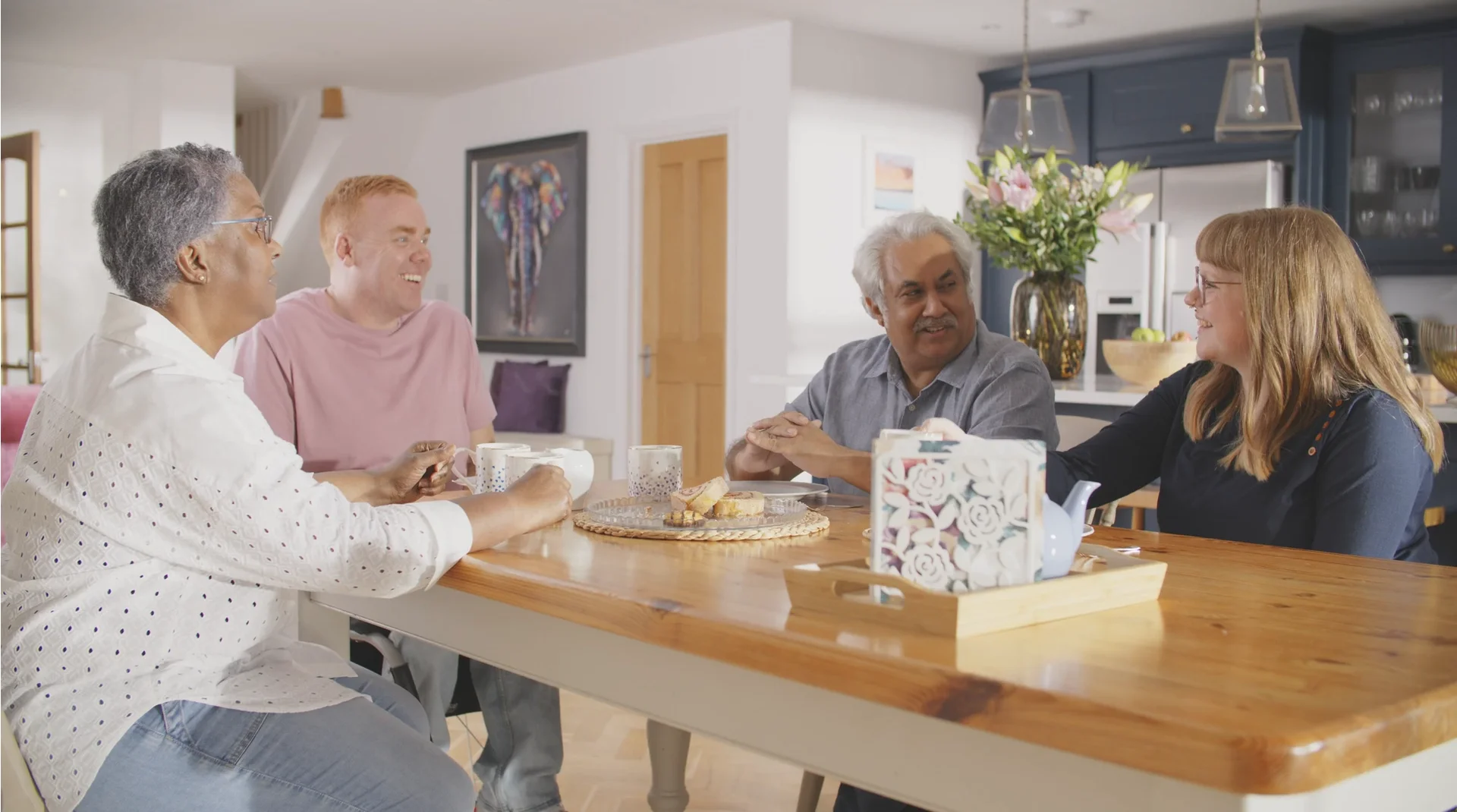 a group of people sitting around a table