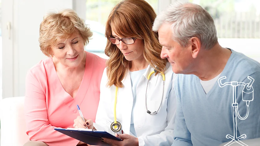 a doctor showing a man and a woman something on a paper